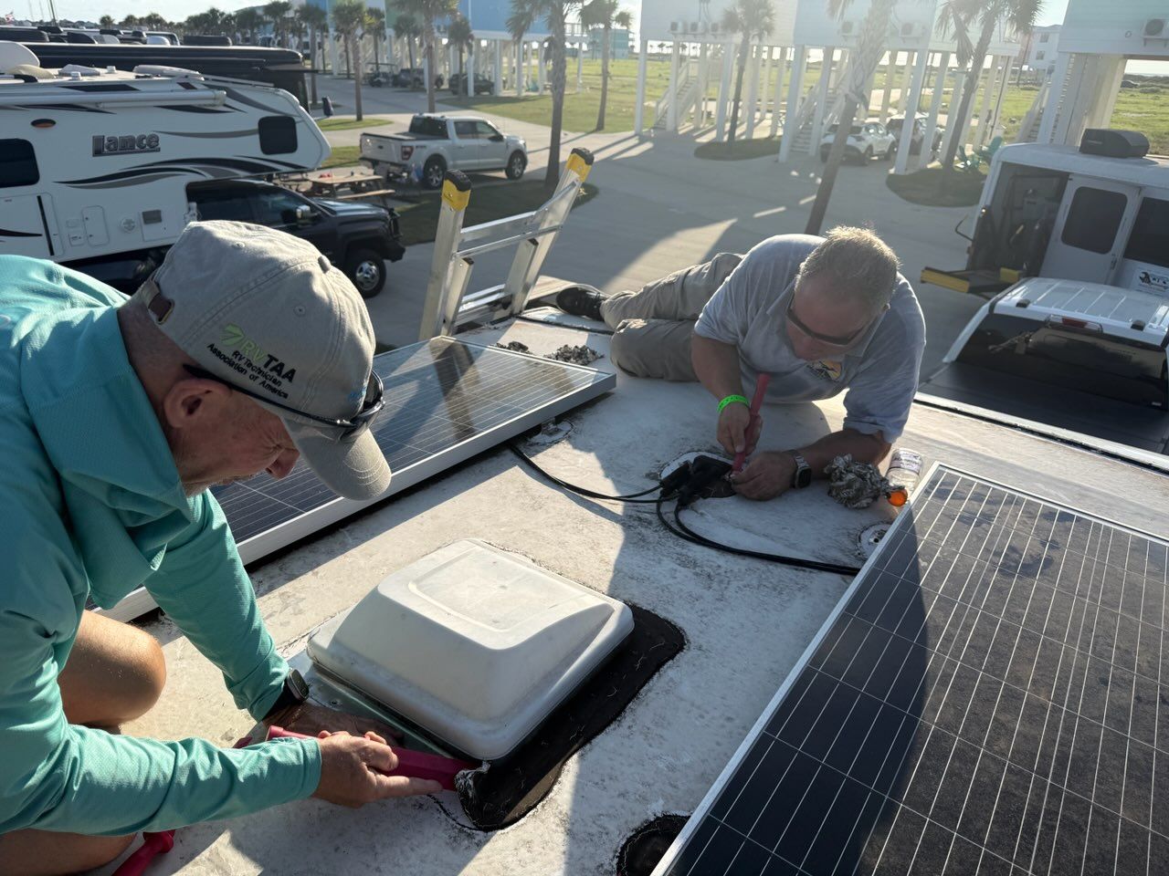 Two technicians working on rooftop solar at the Texas Resort Getaway