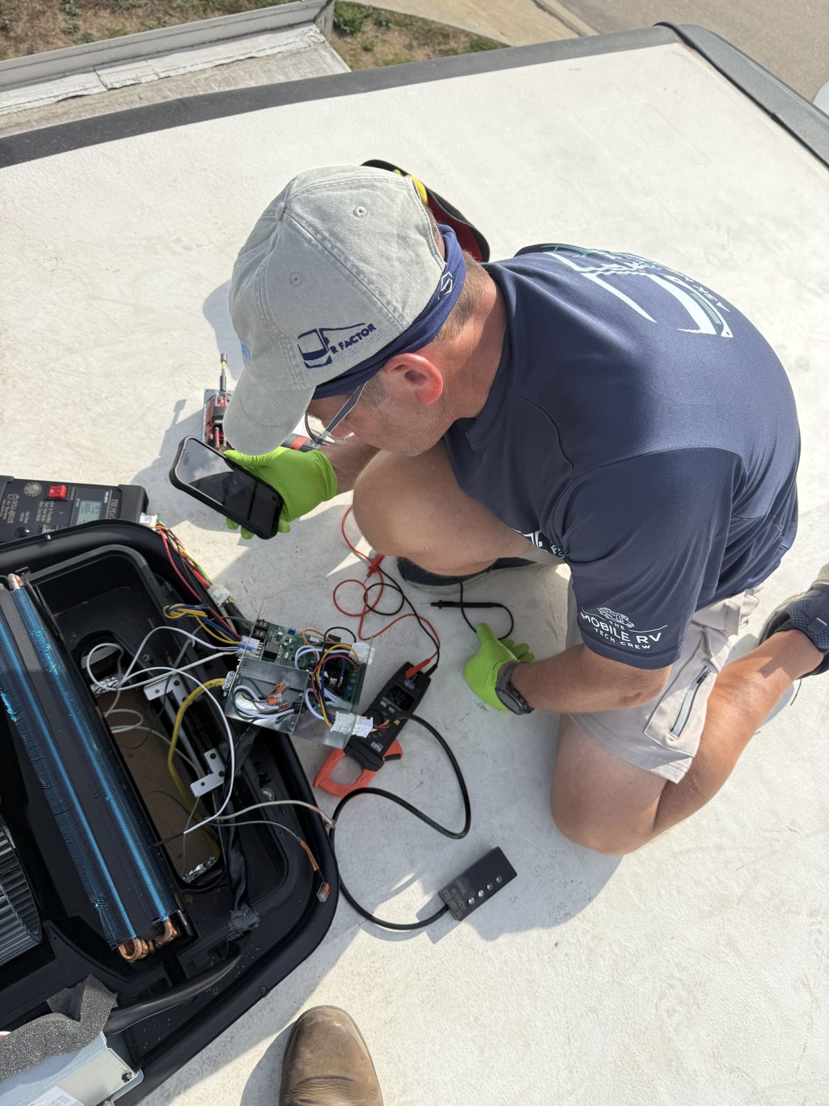 Testing an air conditioner control board on an RV roof